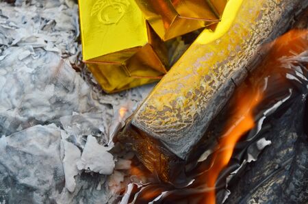 gold paper burning to ancestorの写真素材