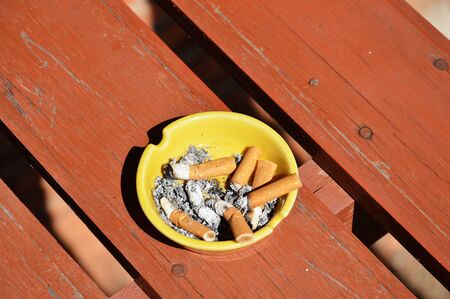 ashtray on wood boardの写真素材