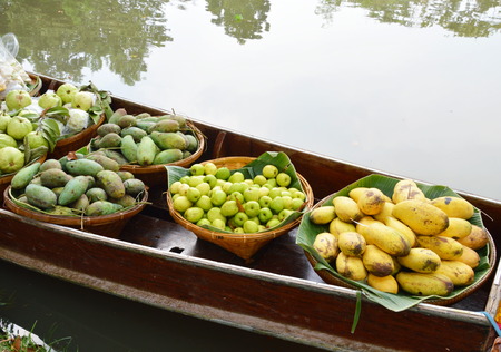 Thai fruit on wooden boatの写真素材