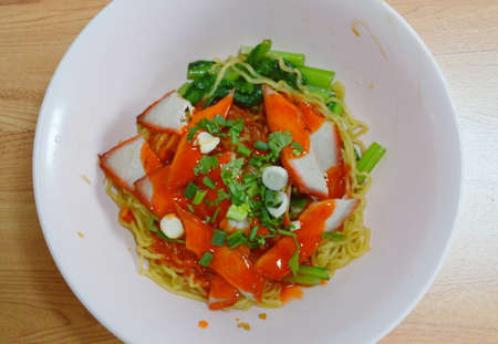 Chinese noodle topping slice barbeque pork and dressing sweet red sauceの写真素材