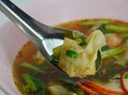 wonton into spoonの写真素材