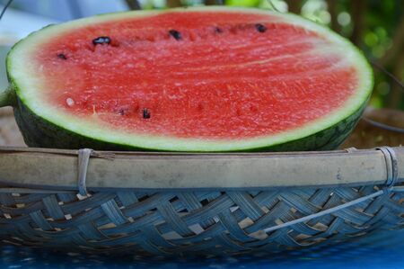 watermelon on bamboo shallow trayの写真素材