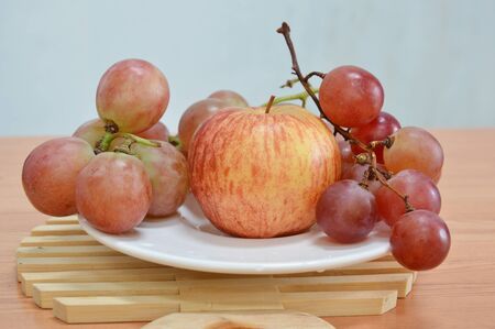 apple and red grapeの写真素材