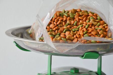 dog food in plastic bag on weighting scale tray