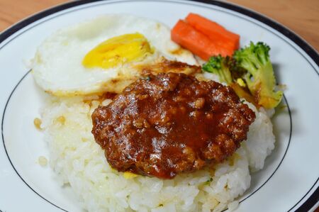 pork steak and fried egg with Japanese riceの写真素材