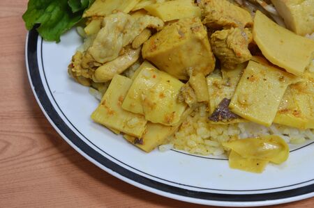 bamboo shoot curry with chicken on riceの写真素材