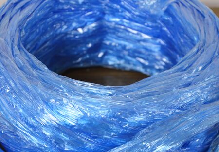 blue plastic rope roll on tableの写真素材