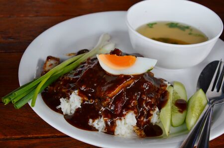 barbecue pork dressing sweet sauce and boiled eggの写真素材