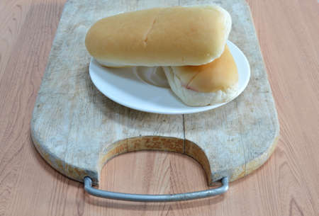 bread on wooden chop blockの写真素材
