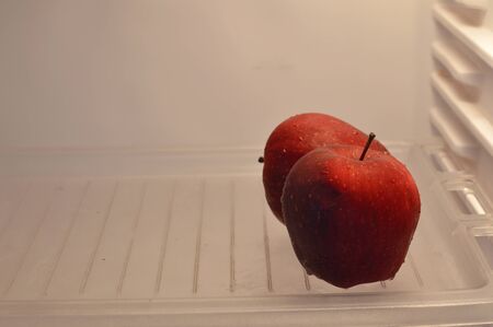 apple in refrigeratorの写真素材