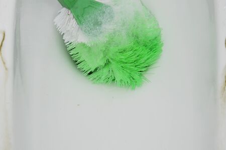 toilet brush clean in sewer holeの写真素材