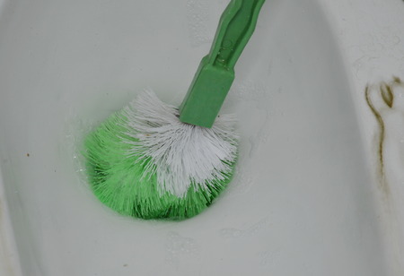 toilet brush clean in cesspool holeの写真素材