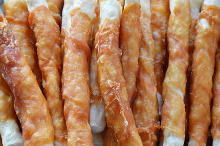 dog snack chicken roll on stainless weighting scale trayの写真素材