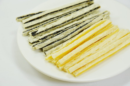 fish snack line filling sesame and cheese on dish
