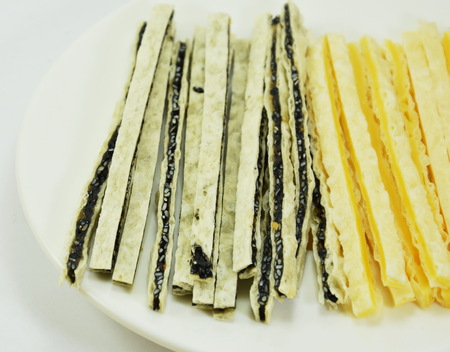 fish snack line filling sesame and cheese on dish