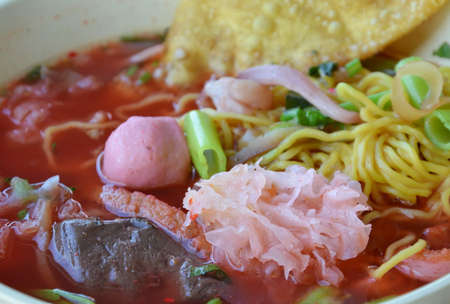 Chinese noodle in red soupの写真素材