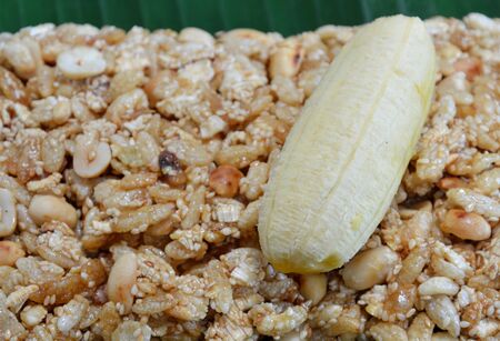 sweet made of rice nut sesame eat with golden banana for Thai merit dayの写真素材