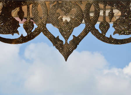 Thai carving in Buddhist temple ceilingの写真素材