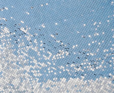 sunlight reflection on silver glass wallの写真素材