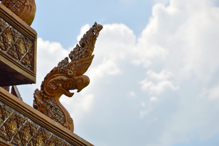 Naka king of snake statue on temple roofの写真素材