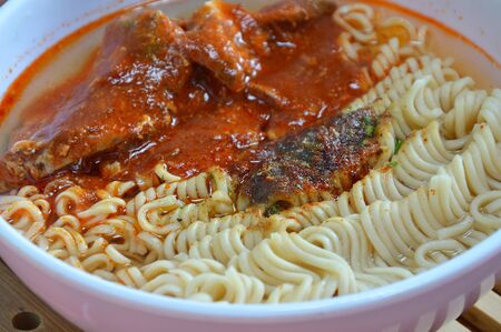 instant noodle with mackerel in ketchup canの写真素材