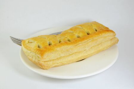 chicken curry filled pie and fork on dish