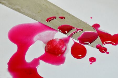 knife and cotton with pink blood