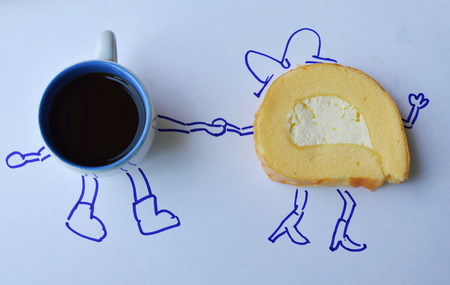 vanilla roll cake with fresh cream eat with black coffee cupの写真素材