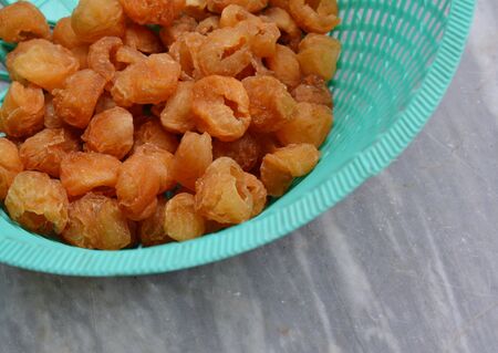 dry longan in plastic basketの写真素材