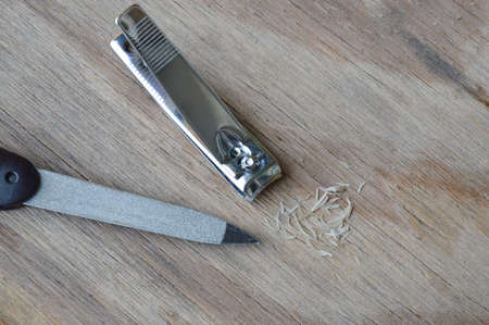 nail clipper and emery file on plankの写真素材