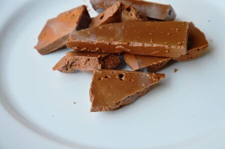 chocolate melt down and smoke on white plateの写真素材