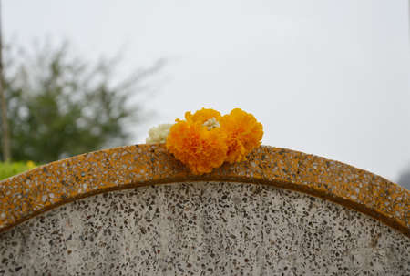 garland on Chinese tombstone in Qingming festival