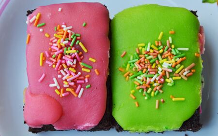 chocolate cake top colorful crispy sugar on plateの写真素材