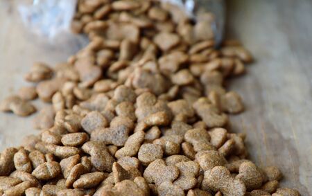pet food pour from plastic bag
