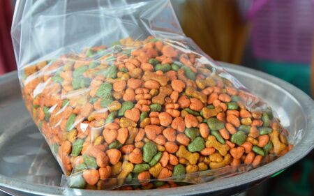 pet food in plastic bag for packing on weighing scale