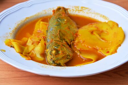 mackerel with bamboo shoot in spicy and sour soup on dish