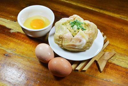 steamed egg with mushroom in cabbage on dishの写真素材