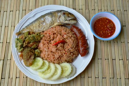 spicy fried rice with shrimp paste sauce and mackerel on dishの写真素材