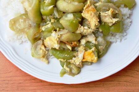 stir fried gourd with egg on riceの写真素材