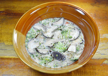 steamed egg fill mushroom and broccoli on bowlの写真素材