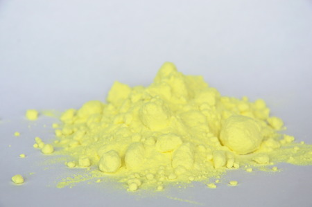 sulfur powder on white paperの写真素材