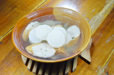 boiled radish and slice fish line hot soup on bowlの写真素材