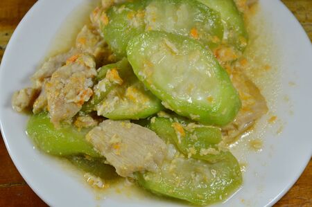 stir fried zucchini with egg and pork on dishの写真素材