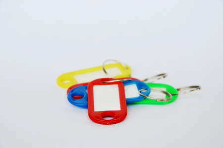colorful plastic name tag on white backgroundの写真素材