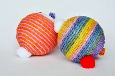 dog and cat toy ball wrap colorful hemp rope on white background