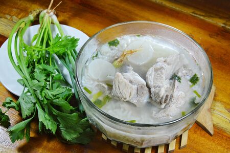 rice porridge with pork bone hot soup and fresh vegetable