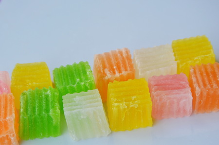 colorful crispy candy on white dishの写真素材