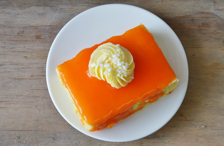 orange butter cake jam topping cream on dish