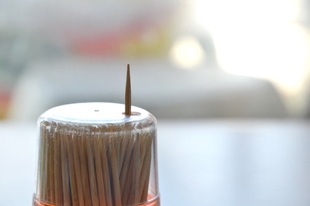 single toothpick out from container holeの写真素材