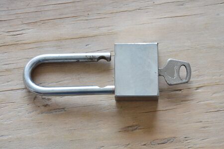 master key unlocked on wooden board